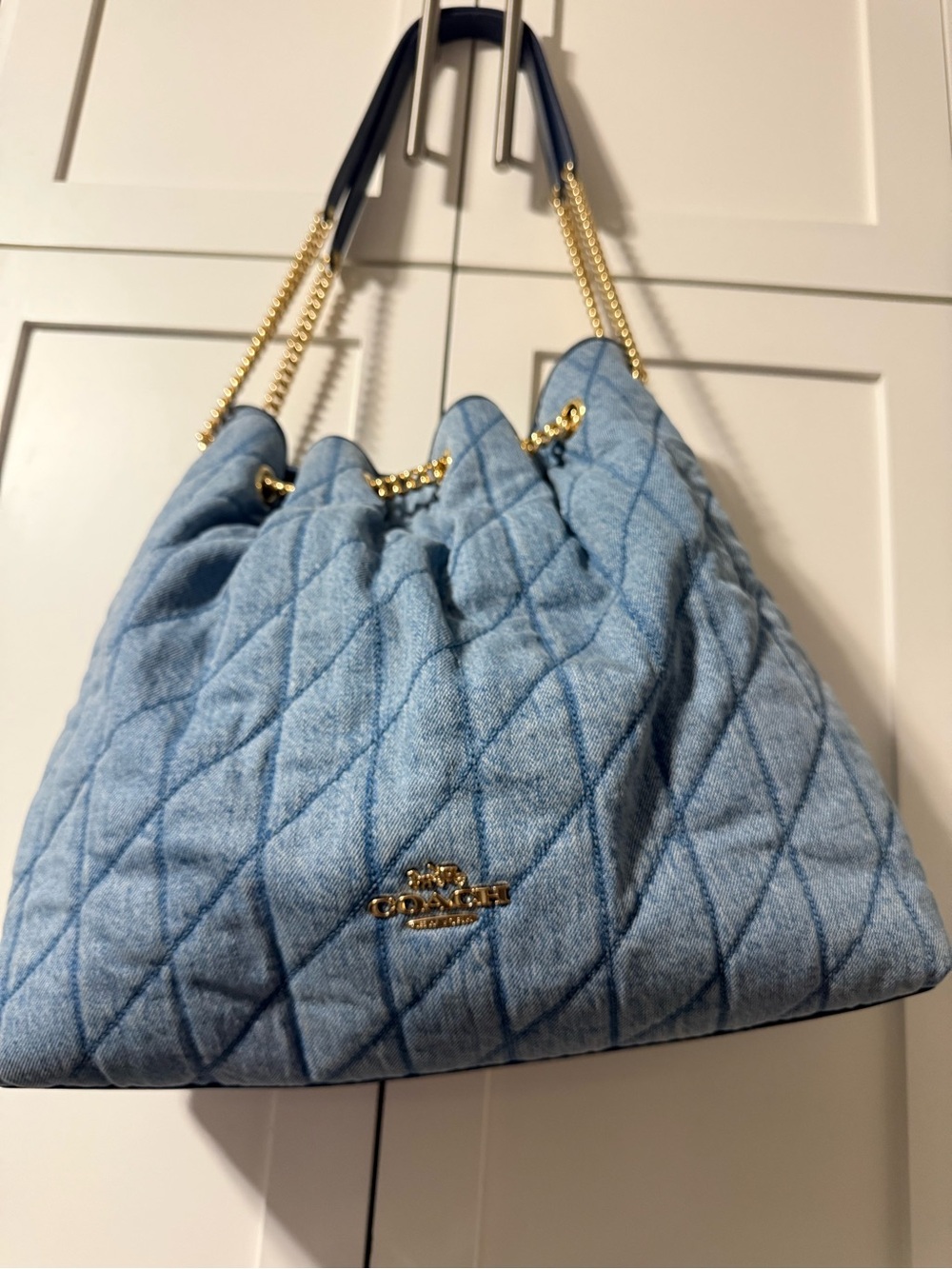 Coach Quilted Denim Drawstring Shoulder Bag in Light Blue with Gold Chain